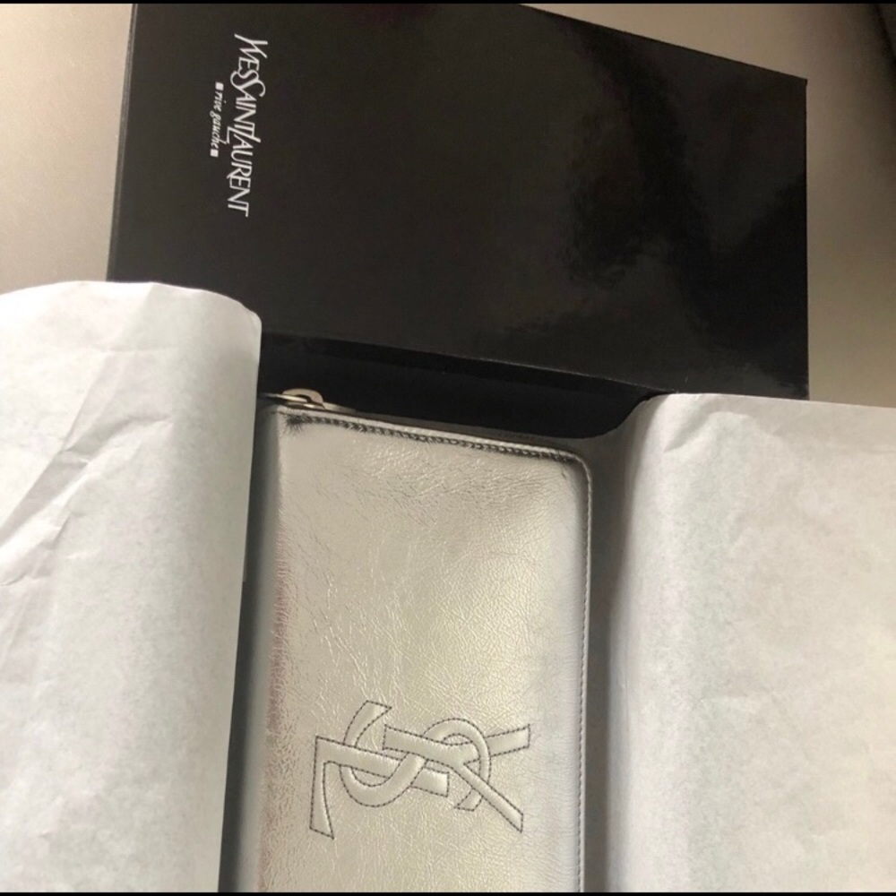 Brand new!  Authentic YSL silver wallet
